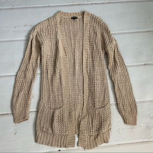 Cozy, cute and practical! Tan knit library sweater. Express, S.